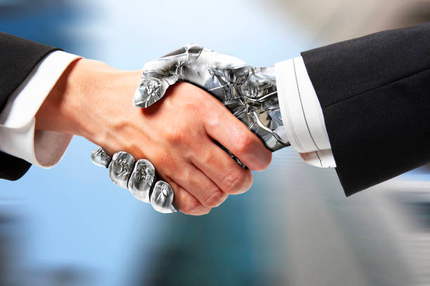 person shaking hands with a robot